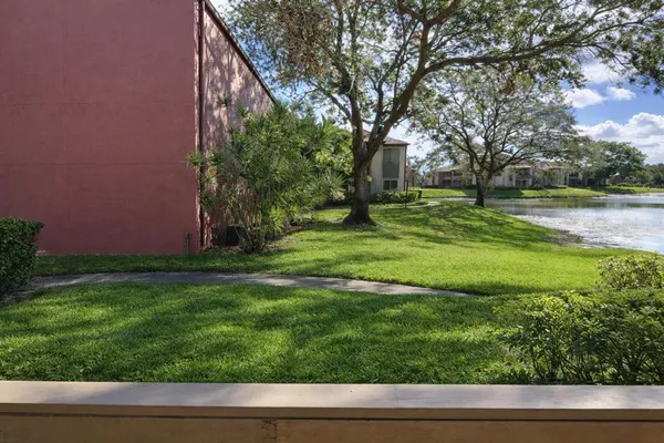 an aerial view of residential houses with outdoor space and river view
