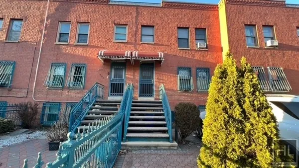 a front view of a multi story residential apartment building