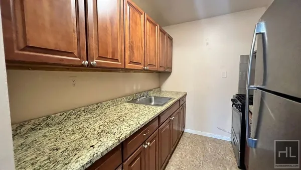 a kitchen with a refrigerator and countertop