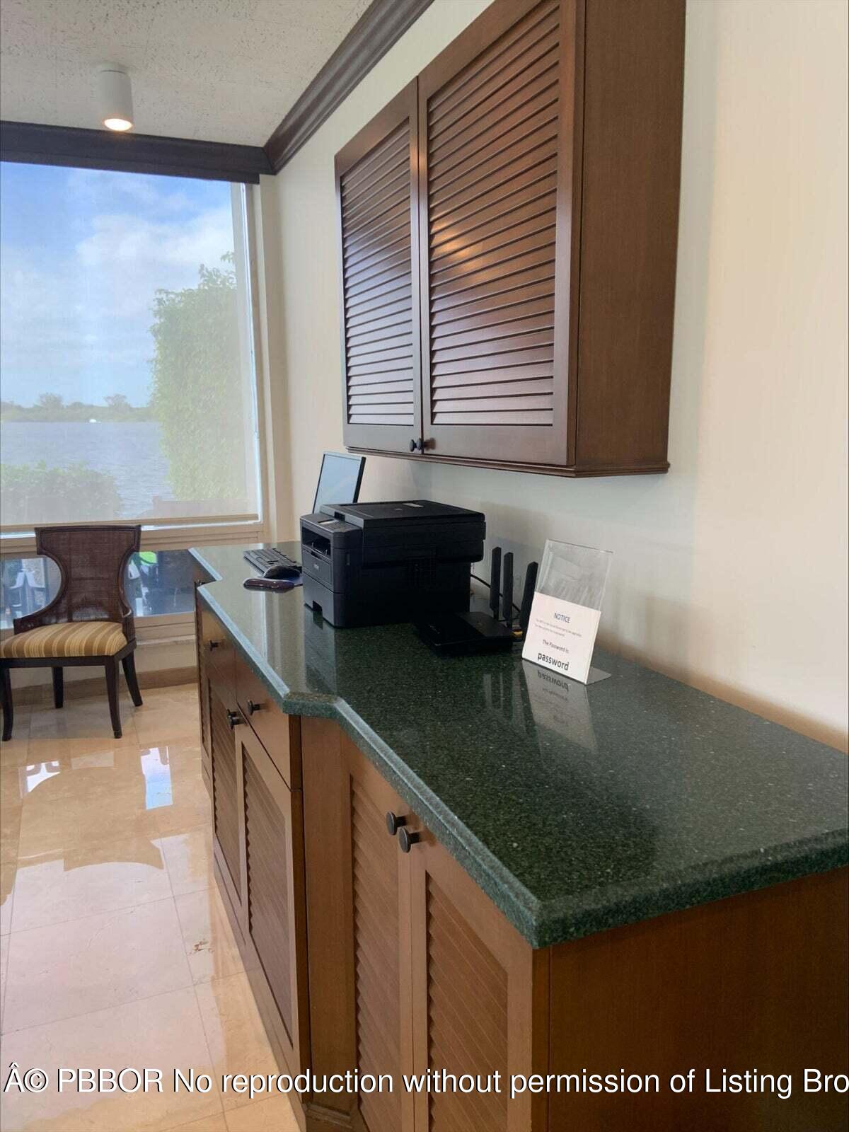 2840 South Ocean Boulevard, Unit 3170 Palm Beach, FL 33480 - Photo 21 of 30 a kitchen with a sink and a black white wooden cabinets