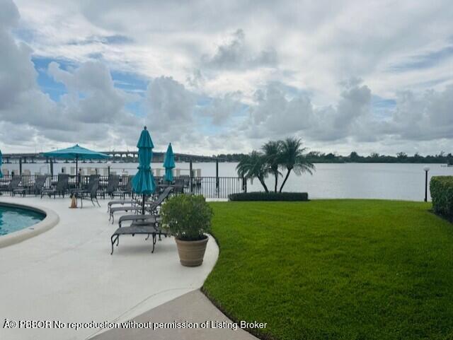 2840 South Ocean Boulevard, Unit 3170 Palm Beach, FL 33480 - Photo 29 of 30 a swimming pool with outdoor seating and garden
