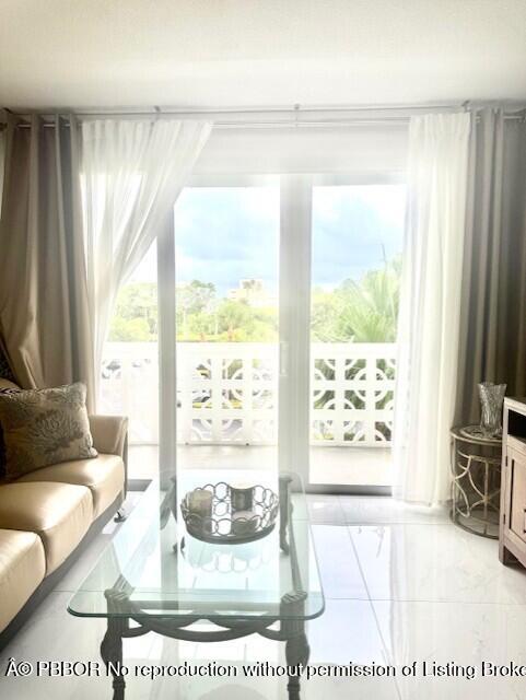 2840 South Ocean Boulevard, Unit 3170 Palm Beach, FL 33480 - Photo 3 of 30 a living room with furniture and a large window