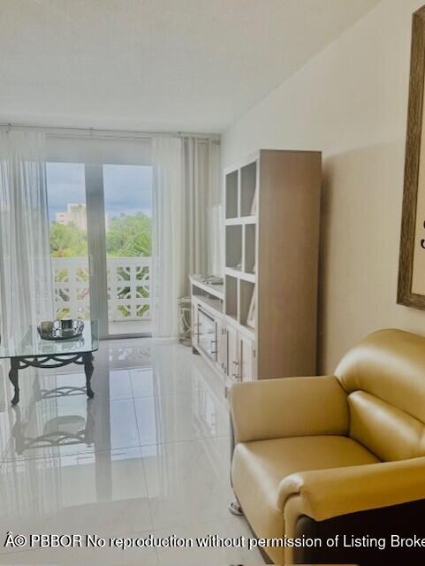 2840 South Ocean Boulevard, Unit 3170 Palm Beach, FL 33480 - Photo 4 of 30 a living room with furniture and a table