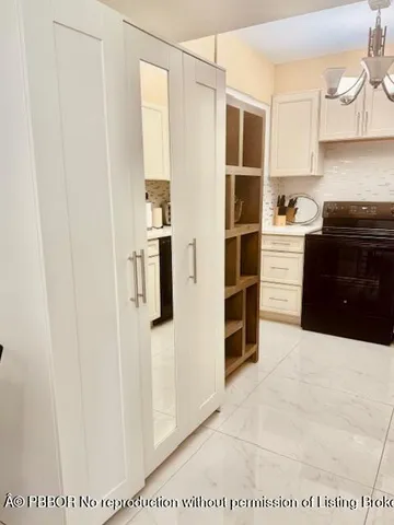 a large bed sitting in a bedroom and a table