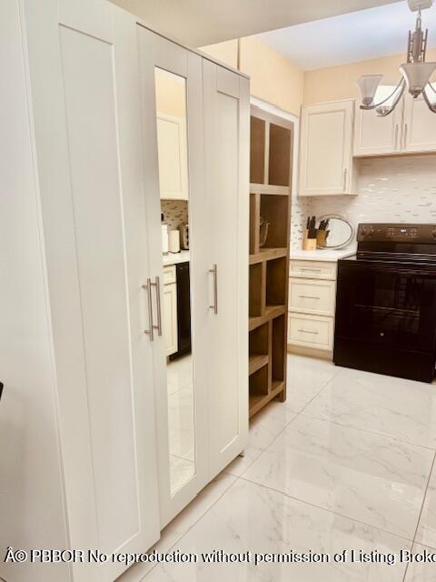 2840 South Ocean Boulevard, Unit 3170 Palm Beach, FL 33480 - Photo 9 of 30 a kitchen with stainless steel appliances a refrigerator and stove