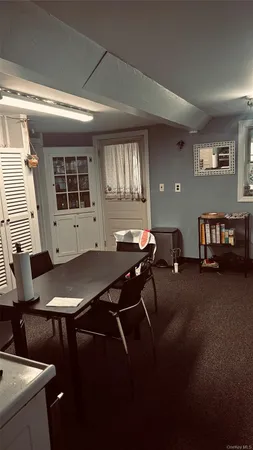 a view of a livingroom with furniture and window