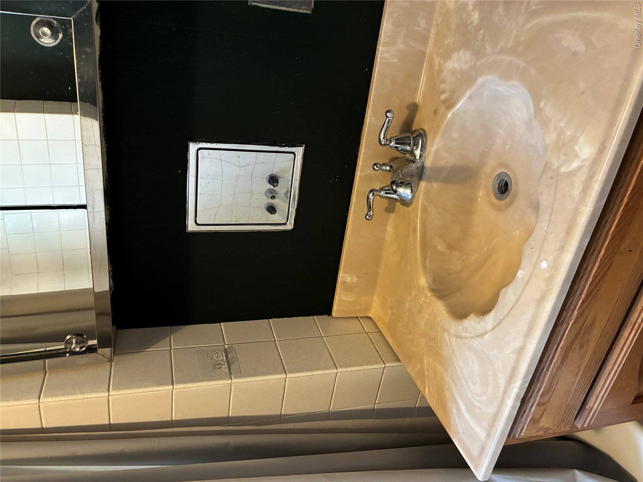6 Pavilion Road Suffern, NY 10901 - Photo 8 of 13 a bathroom with a sink vanity and a mirror