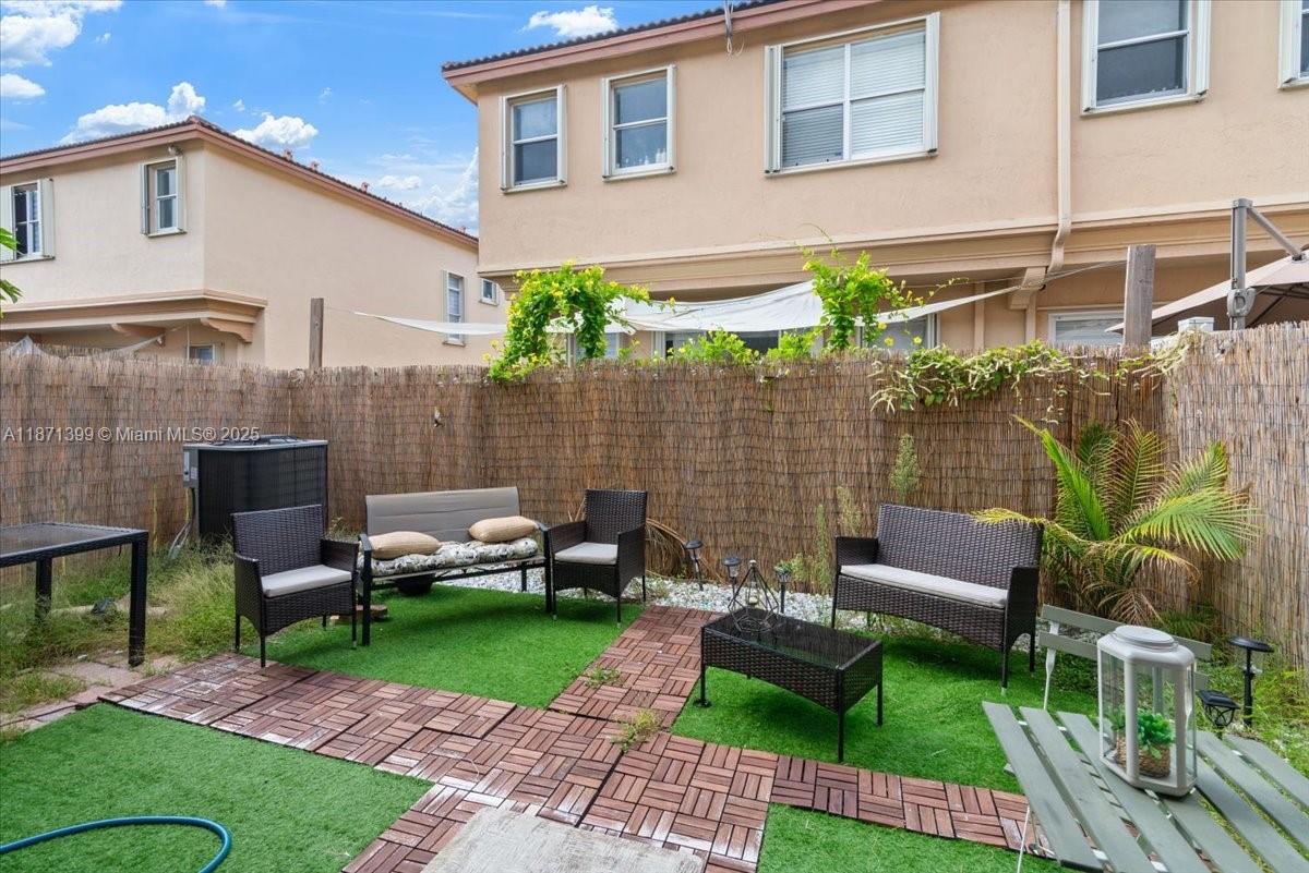12958 Southwest 135th Street Miami, FL 33186 - Photo 12 of 14 a view of a yard with furniture and a yard