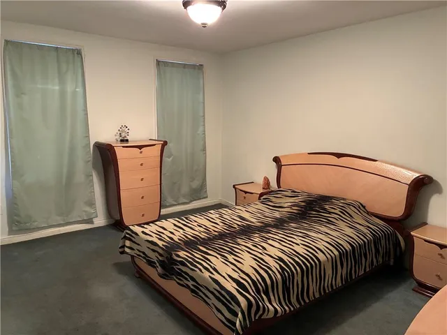 a bedroom with a bed and closet