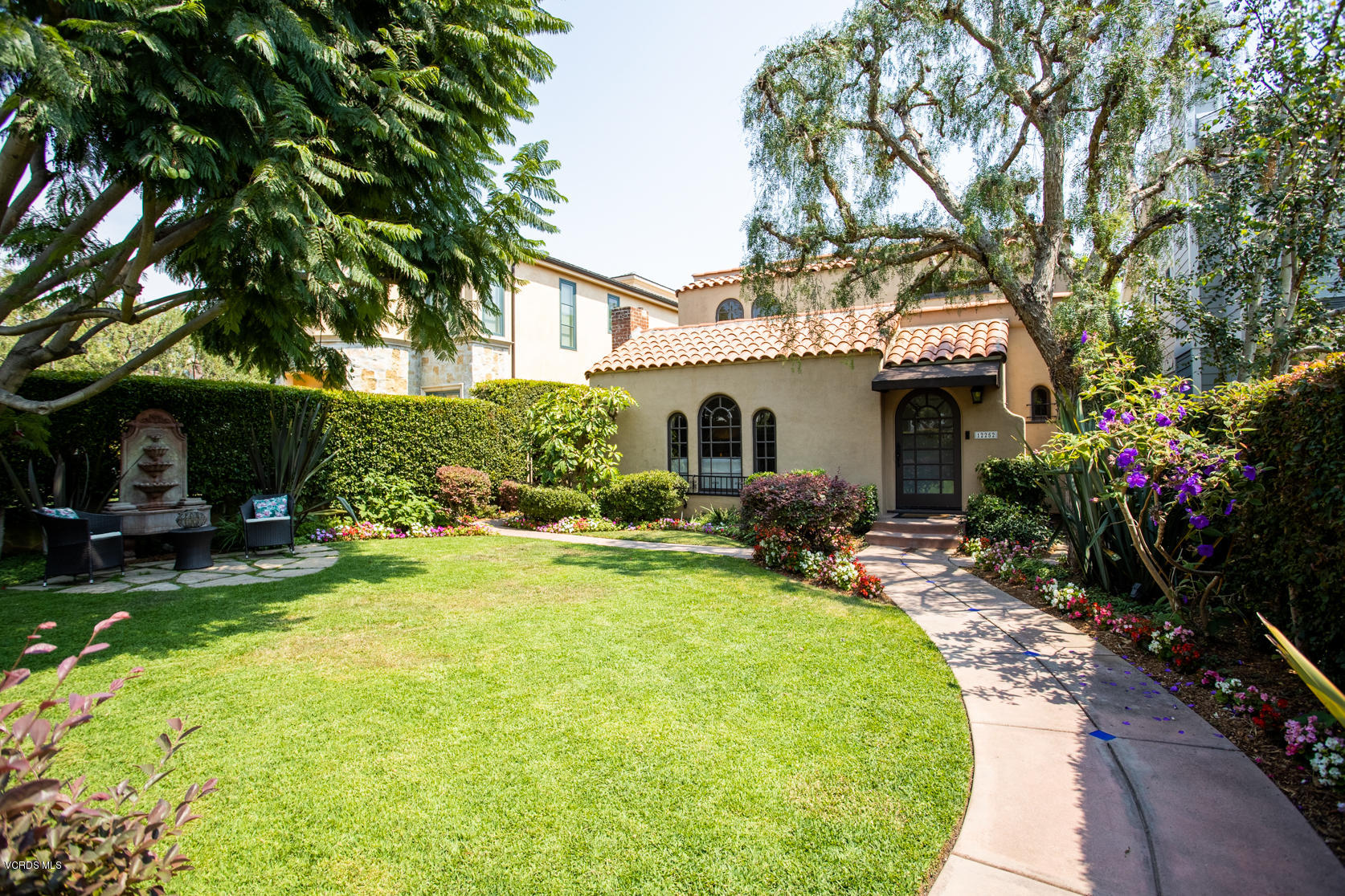 12252 Gorham Avenue Los Angeles, CA 90049 - Photo 1 of 59 a view of a house with backyard sitting area and garden