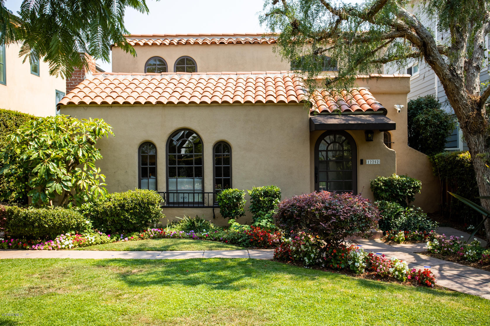 12252 Gorham Avenue Los Angeles, CA 90049 - Photo 2 of 59 a house view with a garden space