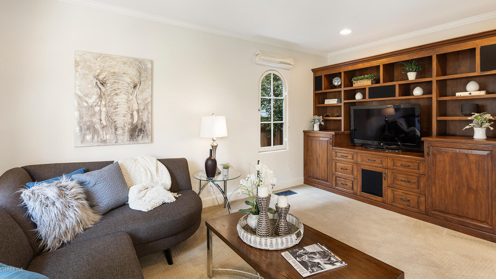 12252 Gorham Avenue Los Angeles, CA 90049 - Photo 14 of 59 a living room with furniture a flat screen tv and kitchen view