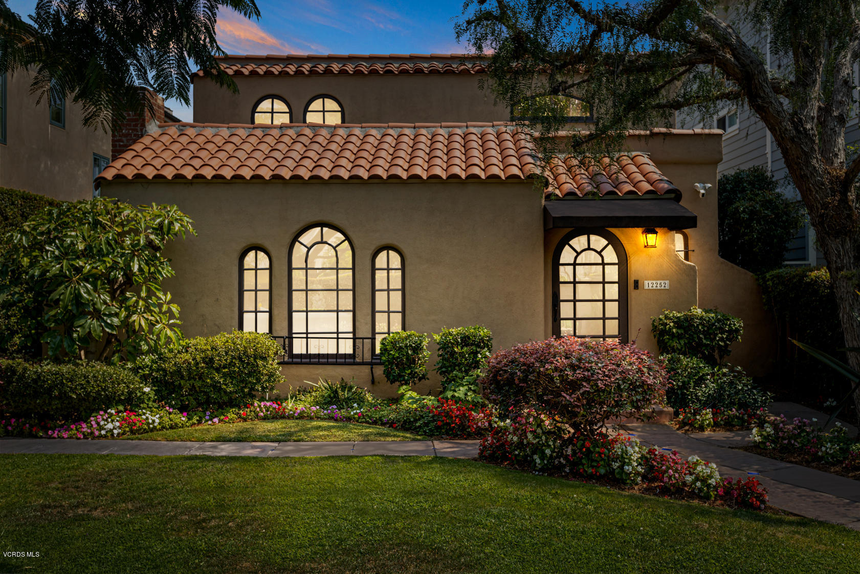 12252 Gorham Avenue Los Angeles, CA 90049 - Photo 3 of 59 a front view of a house with garden
