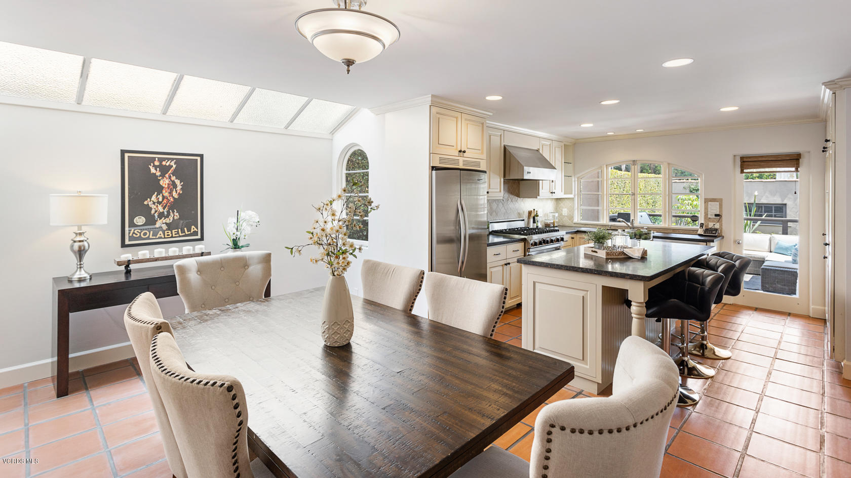 12252 Gorham Avenue Los Angeles, CA 90049 - Photo 22 of 59 a view of a dining room with furniture