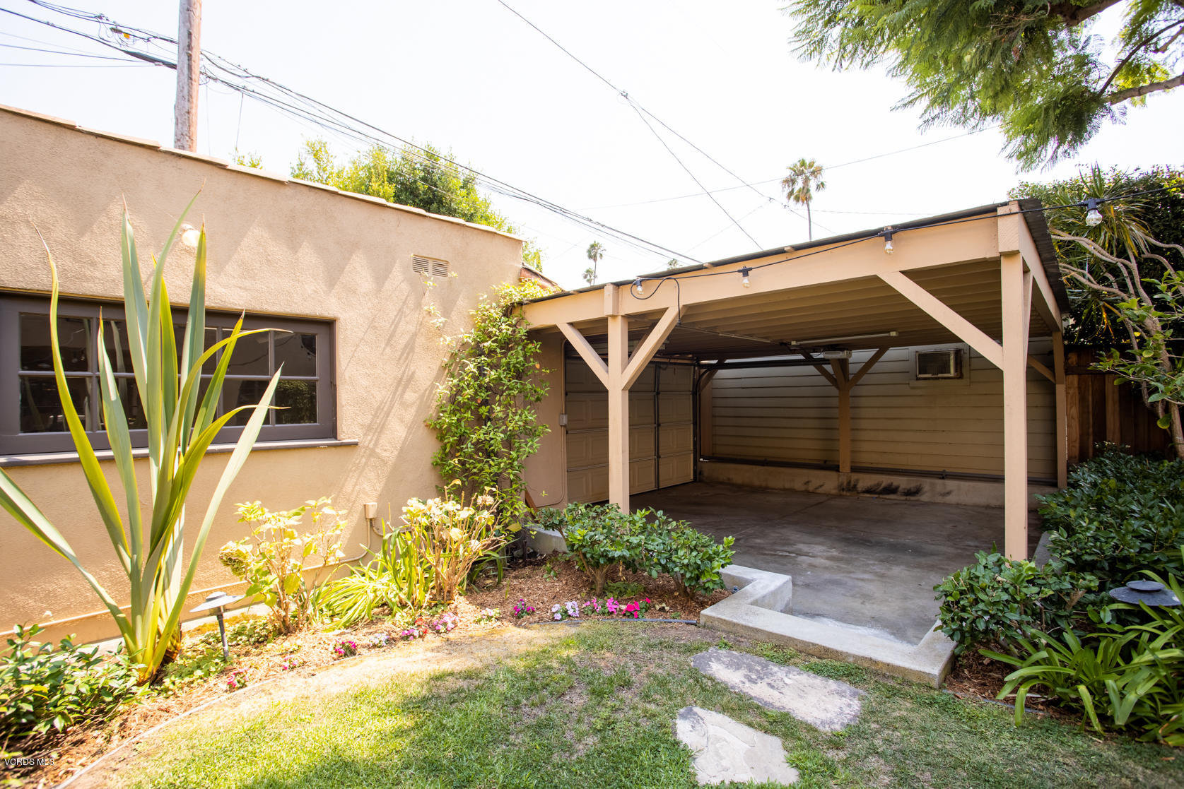 12252 Gorham Avenue Los Angeles, CA 90049 - Photo 27 of 59 a view of a house with a yard