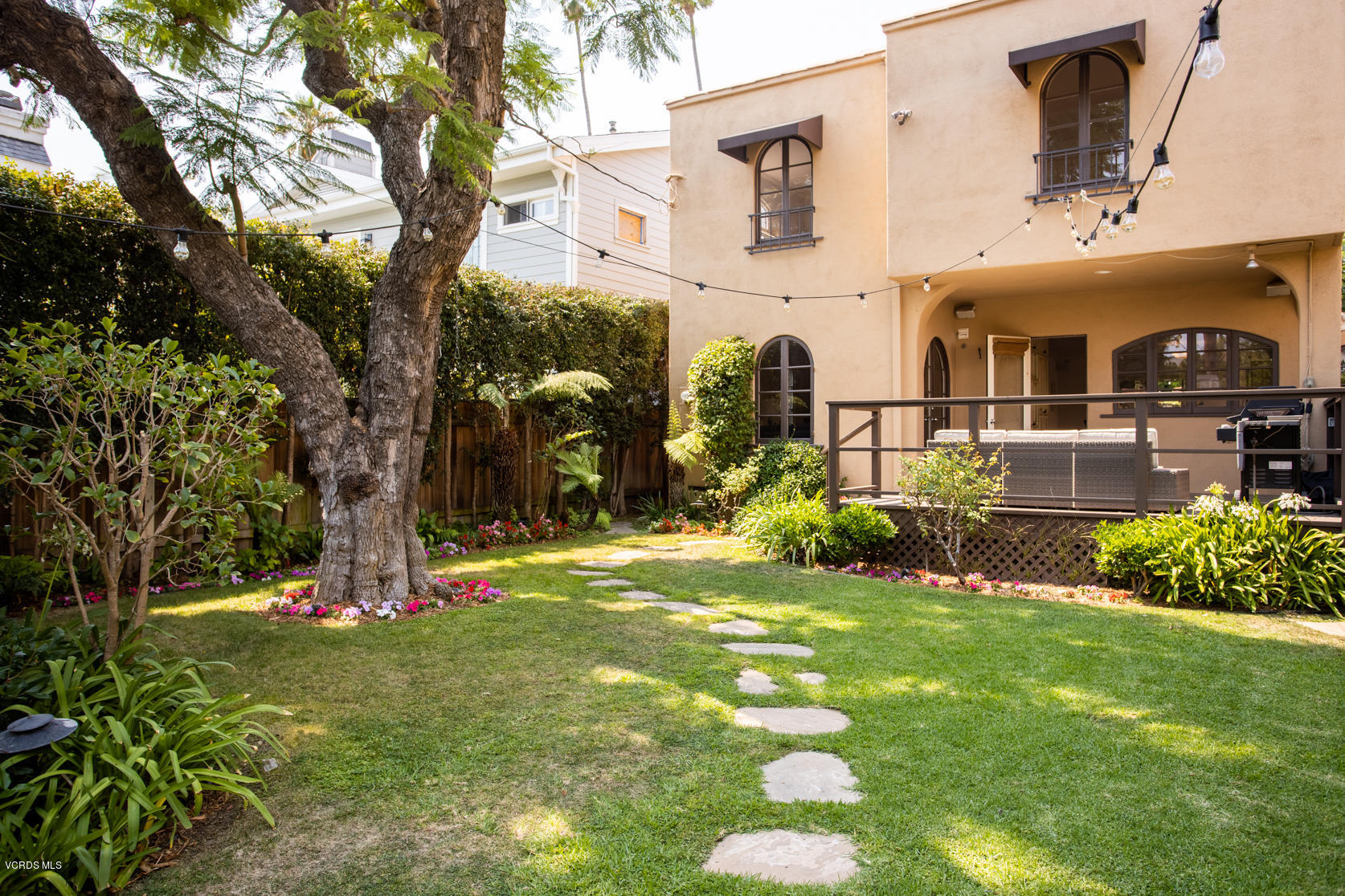 12252 Gorham Avenue Los Angeles, CA 90049 - Photo 28 of 59 a view of a house with a yard