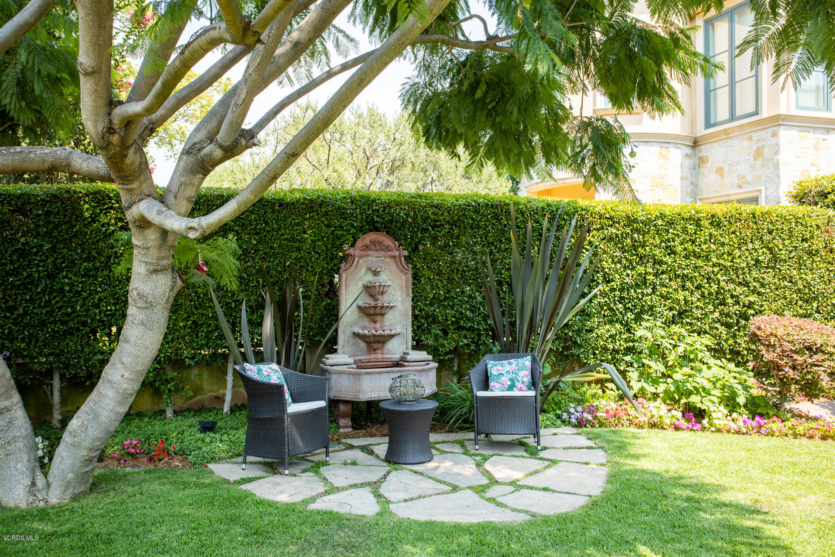 12252 Gorham Avenue Los Angeles, CA 90049 - Photo 4 of 59 a view of a chair and table in backyard of the house