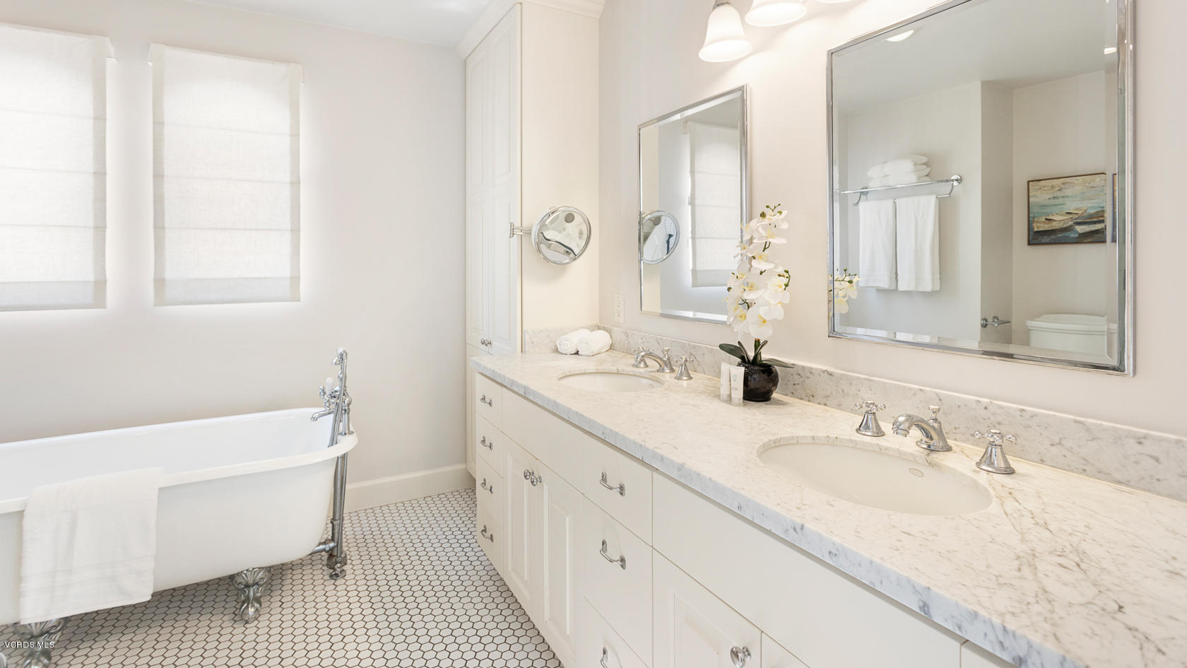 12252 Gorham Avenue Los Angeles, CA 90049 - Photo 35 of 59 a bathroom with a sink double vanity granite tub shower and a mirror