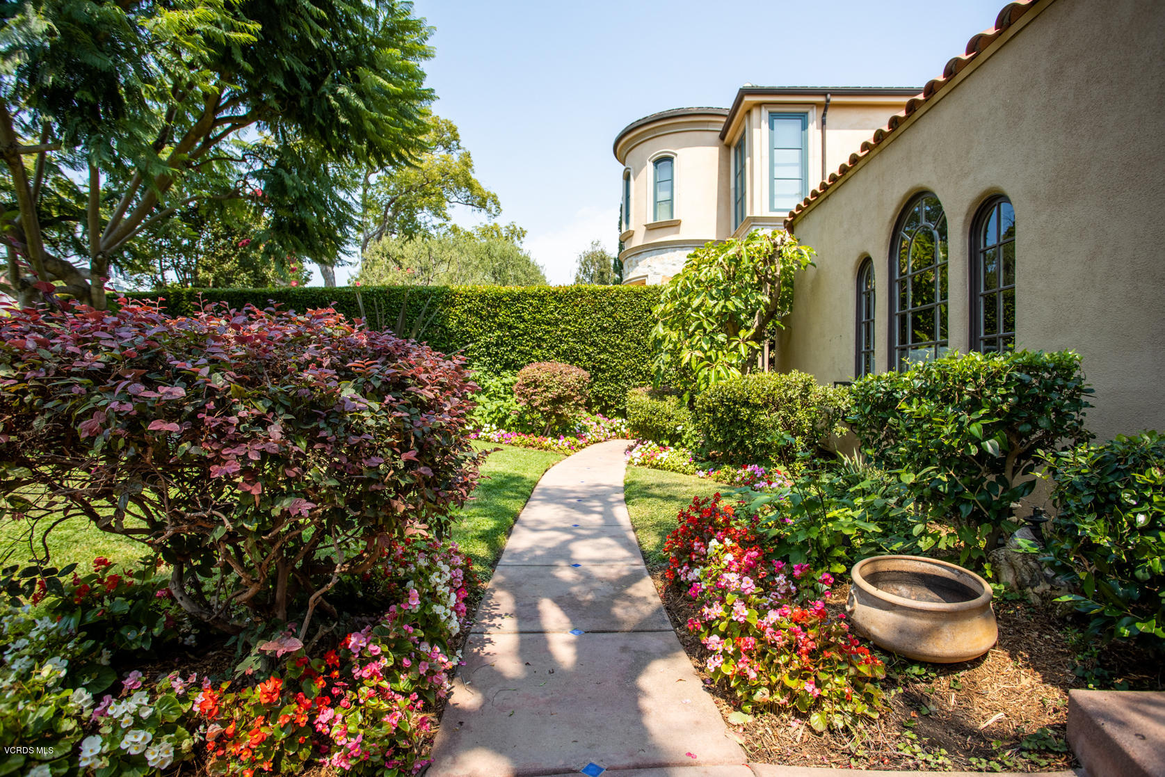 12252 Gorham Avenue Los Angeles, CA 90049 - Photo 5 of 59 a front view of a house with a yard
