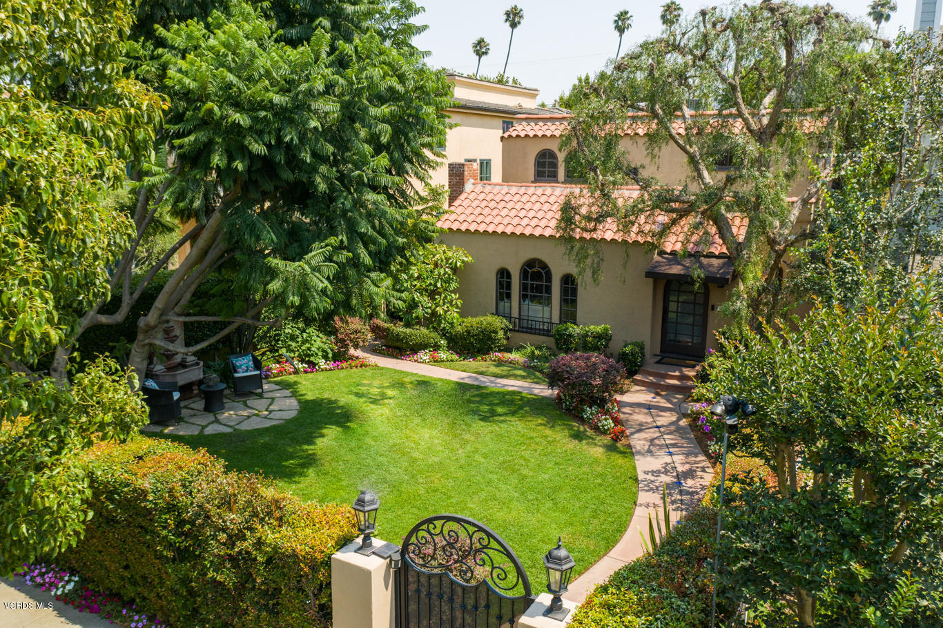 12252 Gorham Avenue Los Angeles, CA 90049 - Photo 53 of 59 a view of a house with a yard and sitting area
