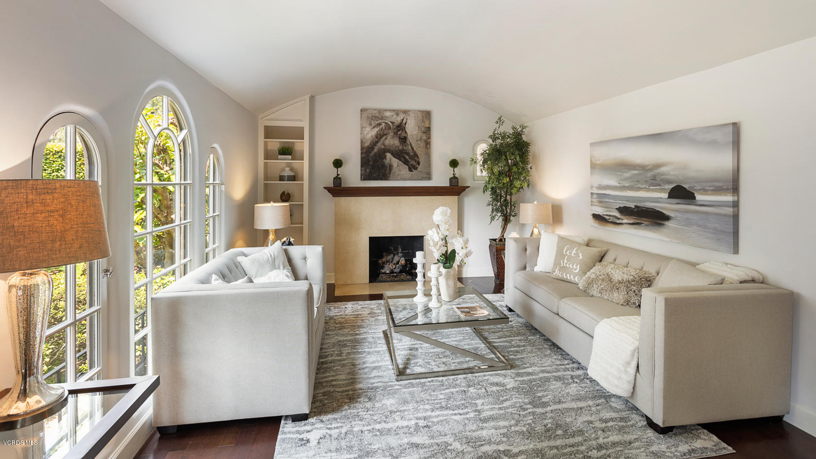 12252 Gorham Avenue Los Angeles, CA 90049 - Photo 7 of 59 a living room with furniture and a fireplace