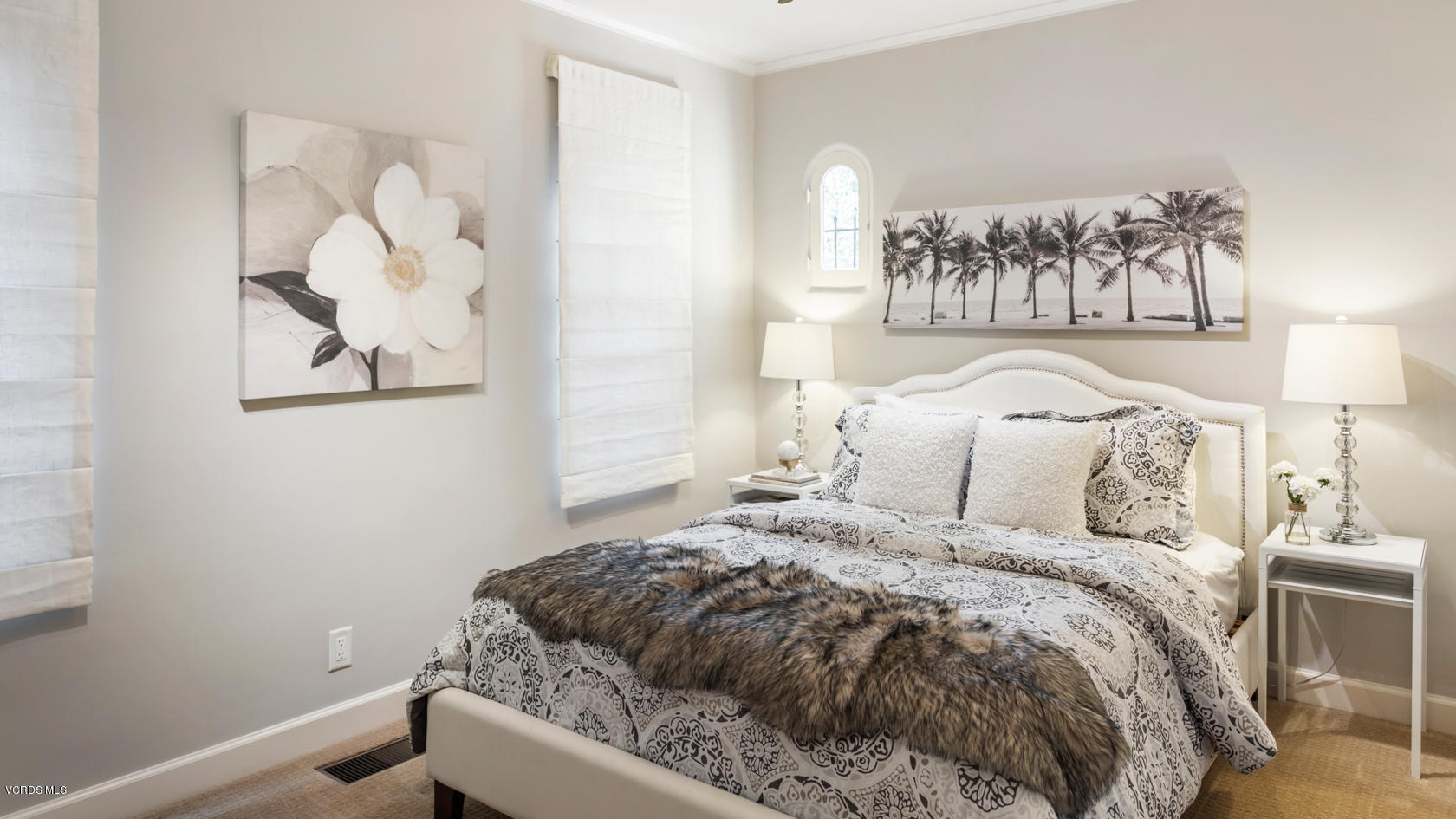 12252 Gorham Avenue Los Angeles, CA 90049 - Photo 10 of 59 a bedroom with a bed and a painting on the wall