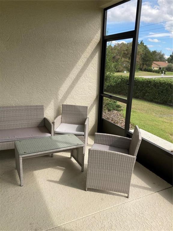 9877 Southwest 99th Loop Ocala, FL 34481 - Photo 9 of 10 a view of balcony with furniture