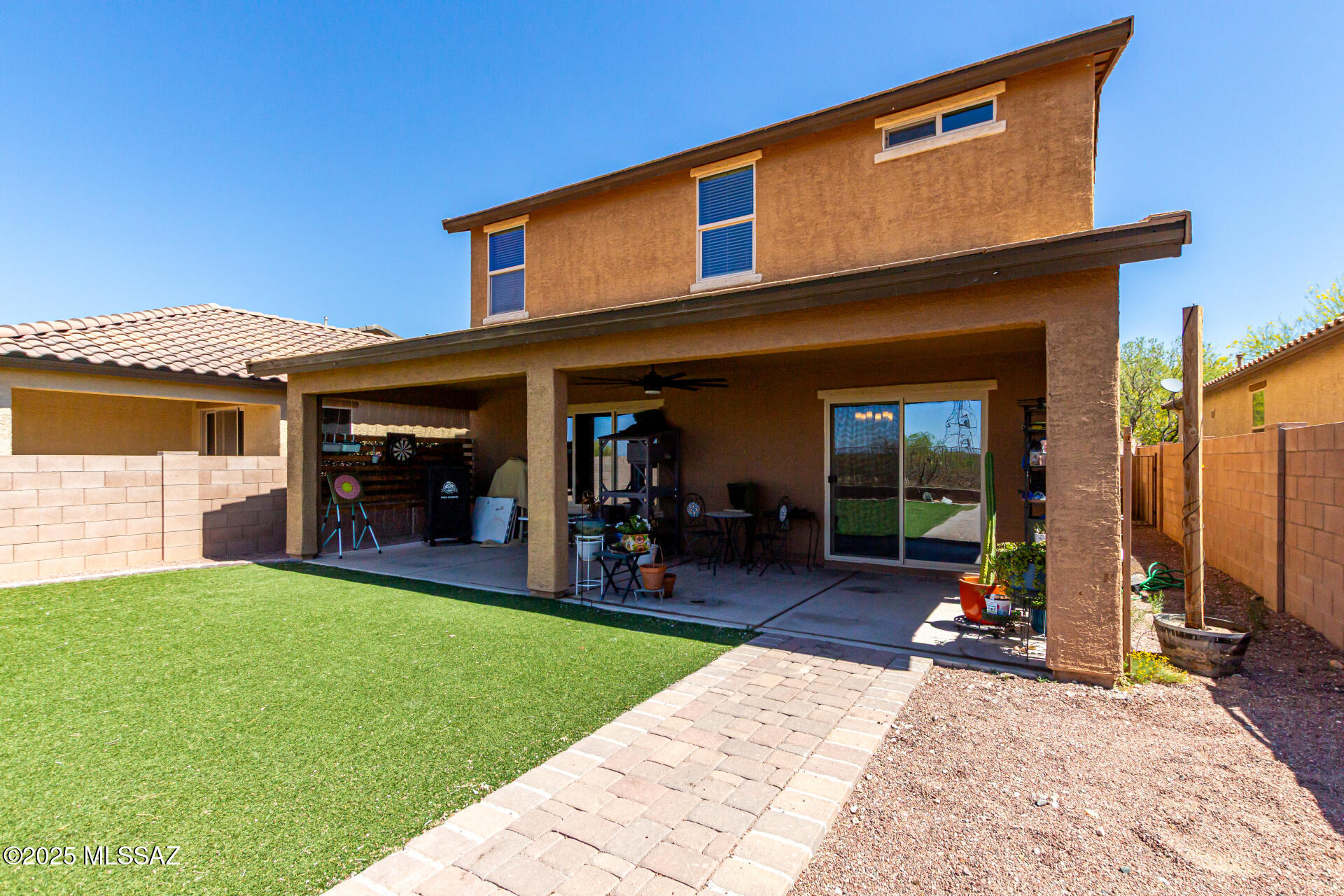 9528 Desert Fauna Loop Tucson, AZ 85747 - Photo 39 of 46 a view of a house with sitting area and furniture