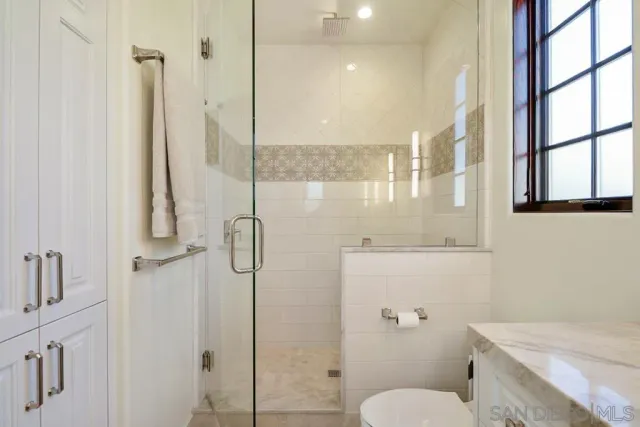 a view of an entryway with wooden floor and windows