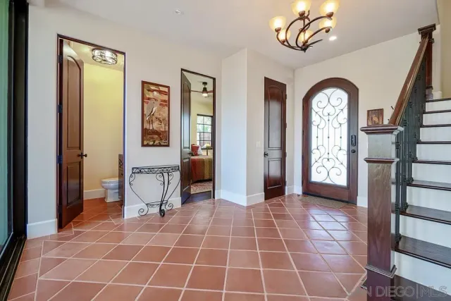 a large kitchen with a table and chairs