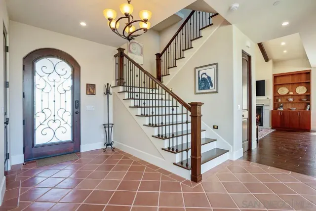 a large kitchen with stainless steel appliances granite countertop sink stove and large window