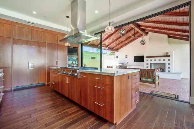 a view of an entryway with wooden floor and windows