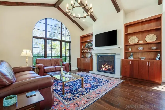 a en suite bathroom with a granite countertop sink and a mirror