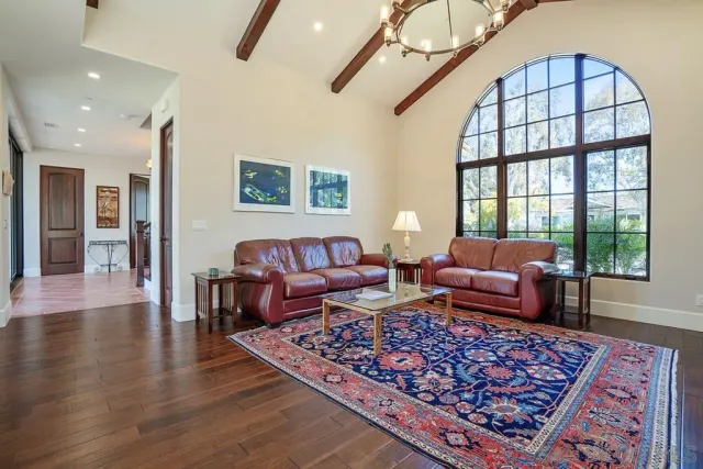 a bathroom with a granite countertop sink a mirror and a shower