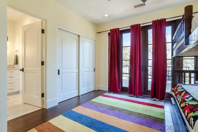 a bathroom with a shower sink and mirror