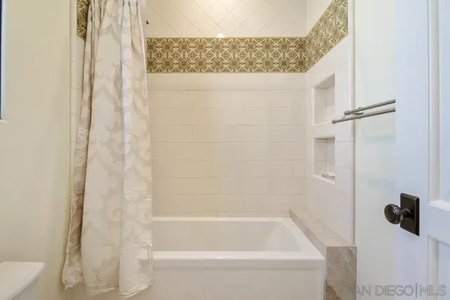 a view of a house with a chairs in a patio