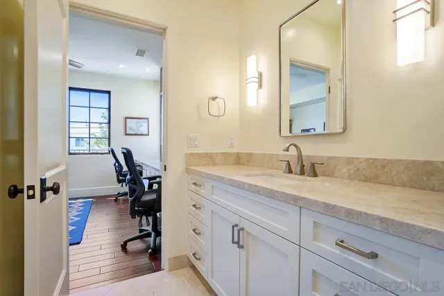 a balcony with table and chairs