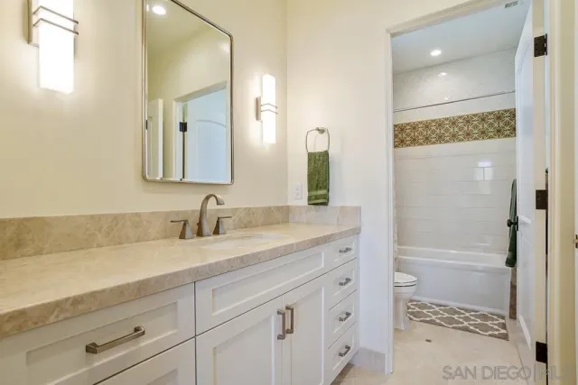 a view of a balcony with wooden floor