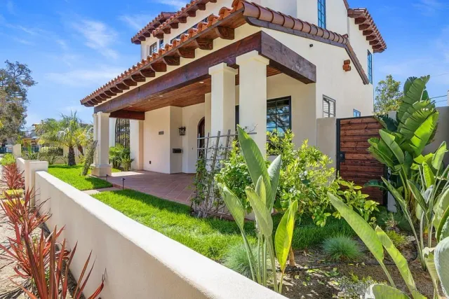 a front view of a house with garden