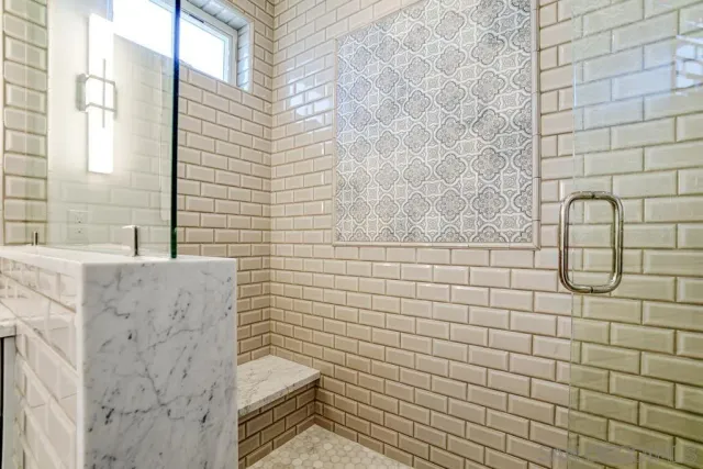 a living room with stainless steel appliances kitchen island granite countertop furniture