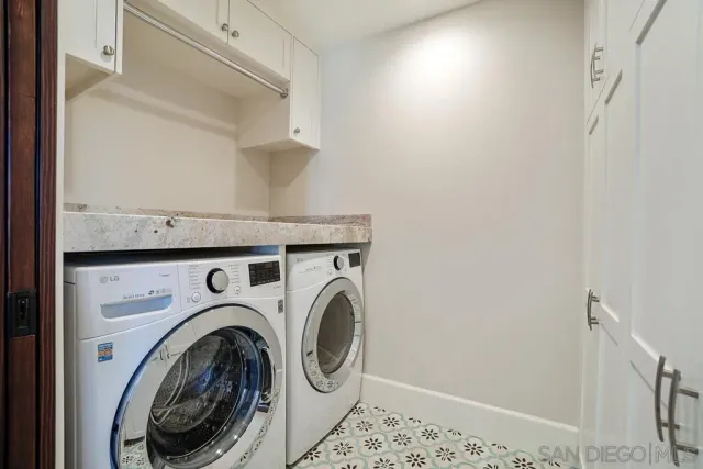 a kitchen with stainless steel appliances granite countertop a stove and wooden floors