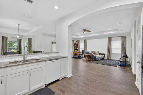 a very nice looking room with a large window and couch
