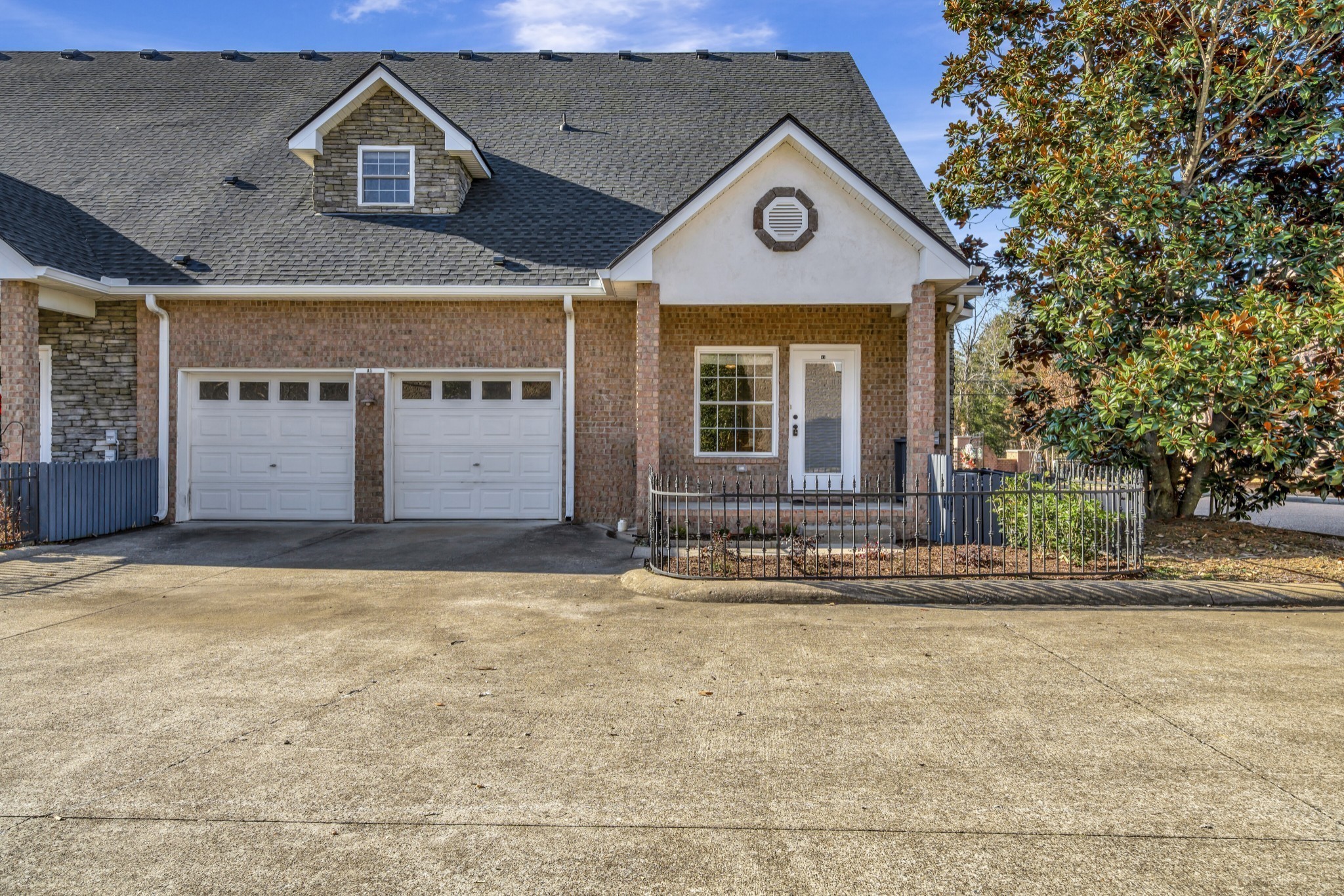1900 Tinnin Road, Unit A5 Goodlettsville, TN 37072 - Photo 1 of 41 a view of a brick house with a large windows