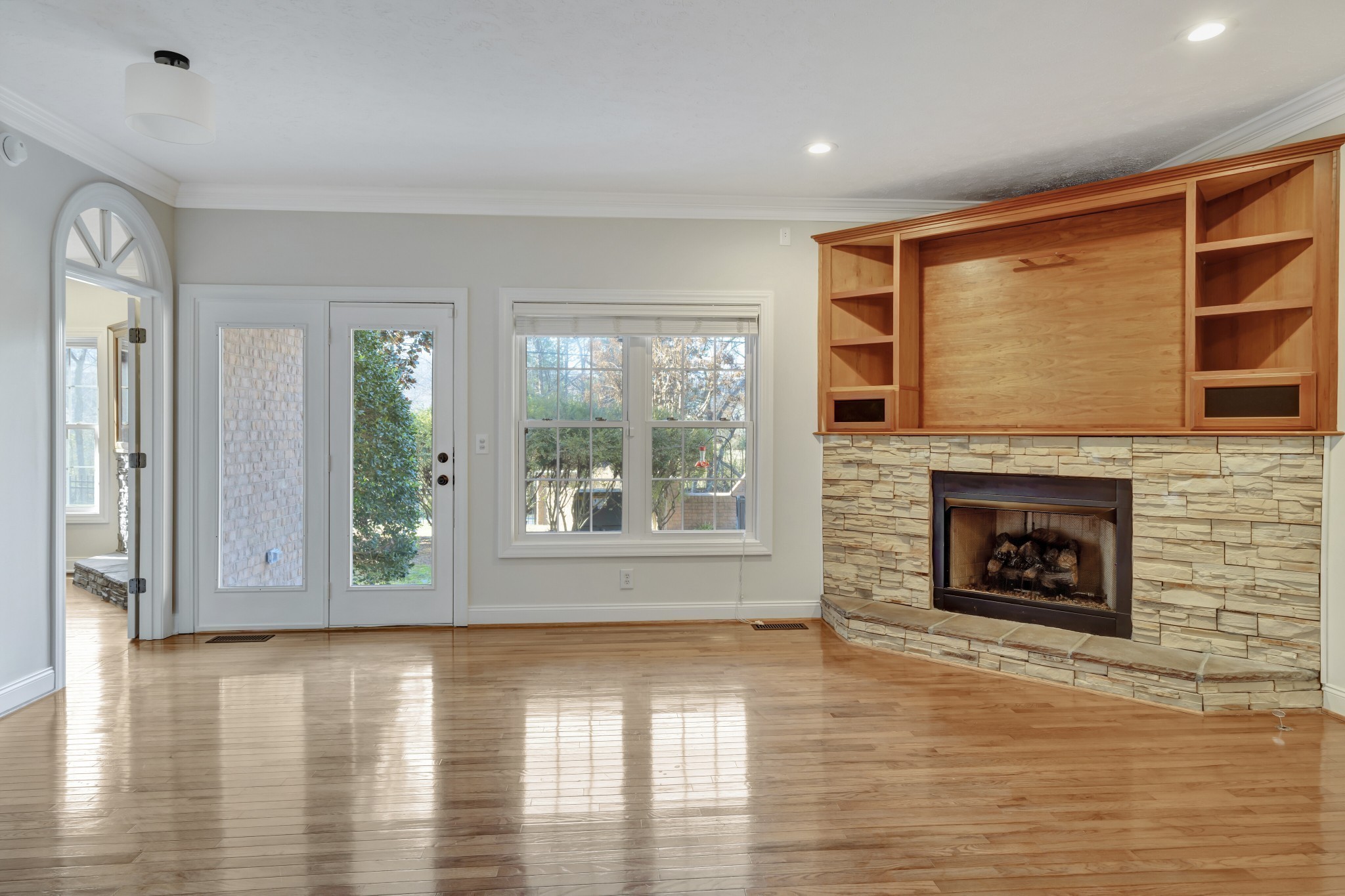 1900 Tinnin Road, Unit A5 Goodlettsville, TN 37072 - Photo 15 of 41 a view of a livingroom with wooden floor a fireplace and window