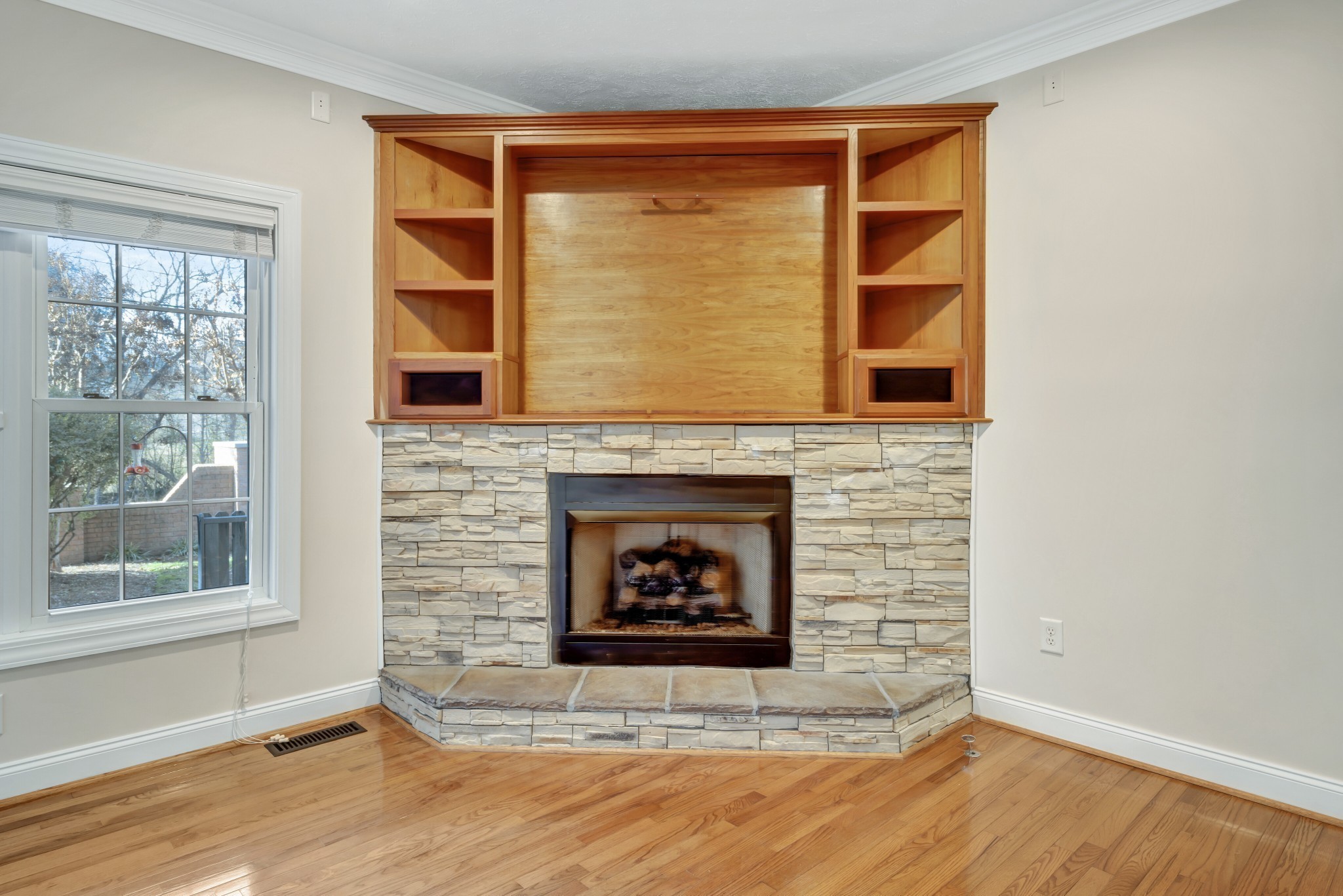 1900 Tinnin Road, Unit A5 Goodlettsville, TN 37072 - Photo 16 of 41 a living room with a fireplace and a floor to ceiling window