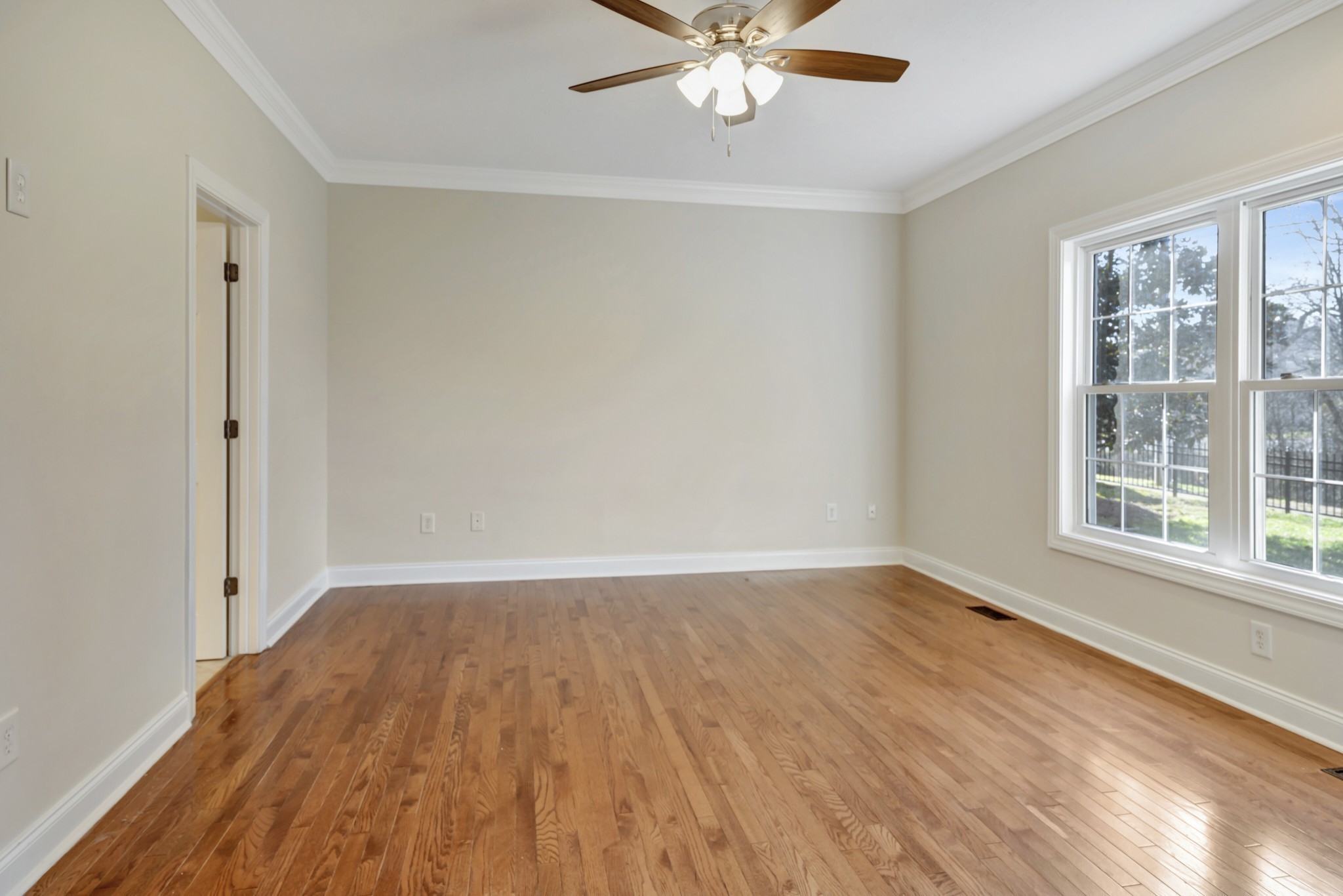 1900 Tinnin Road, Unit A5 Goodlettsville, TN 37072 - Photo 19 of 41 a view of an empty room with wooden floor and a window