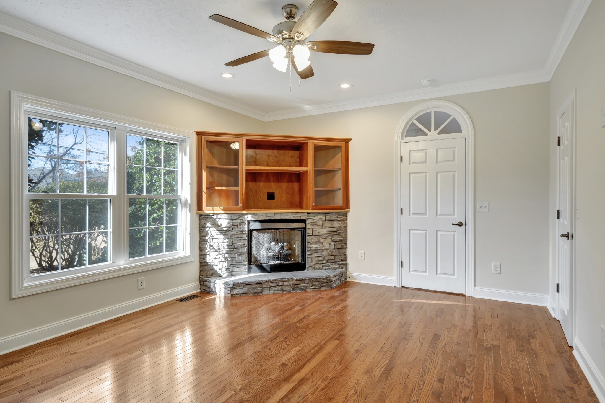 1900 Tinnin Road, Unit A5 Goodlettsville, TN 37072 - Photo 20 of 41 a view of a livingroom with a fireplace a ceiling fan and windows