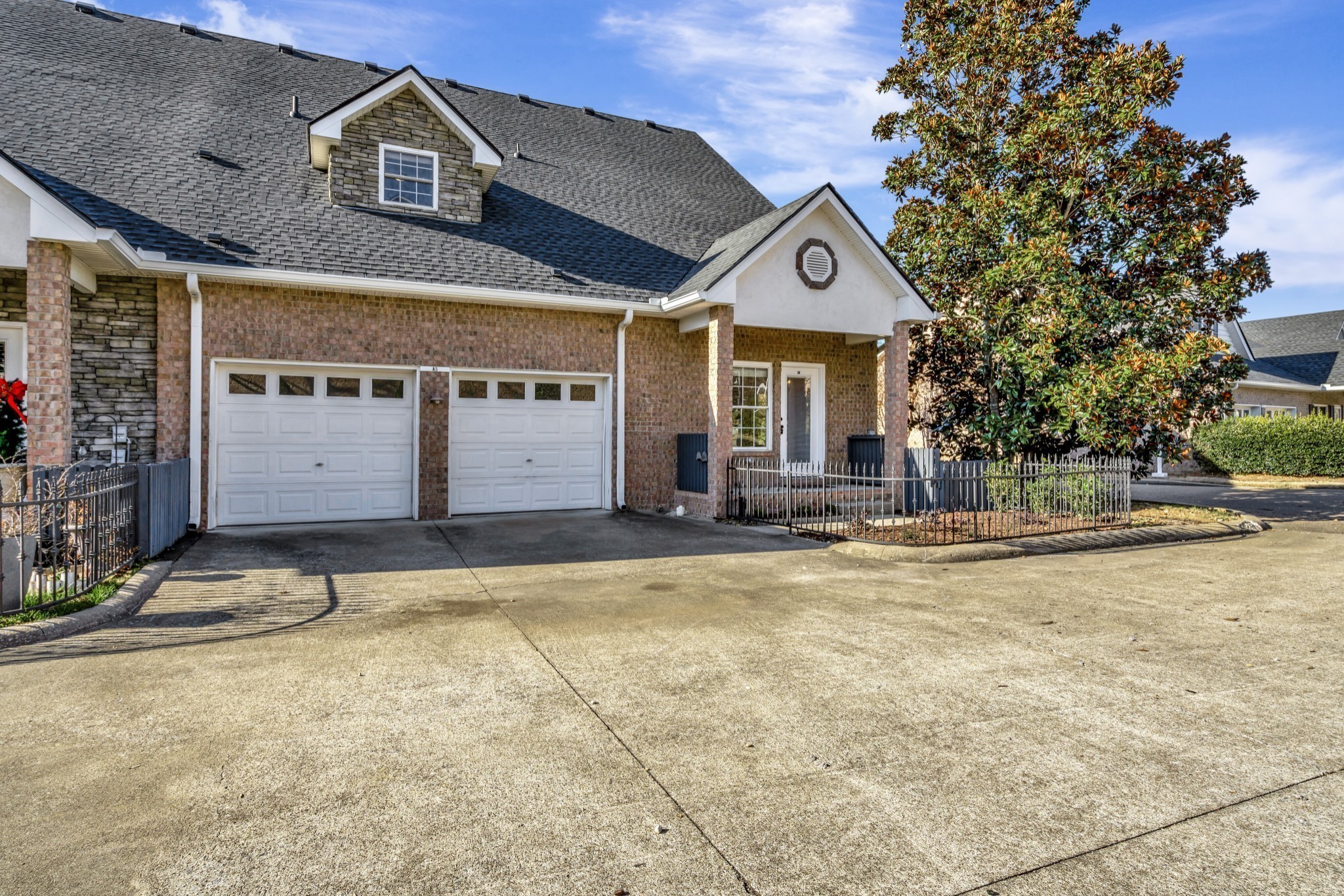 1900 Tinnin Road, Unit A5 Goodlettsville, TN 37072 - Photo 2 of 41 a front view of a house with a yard and garage