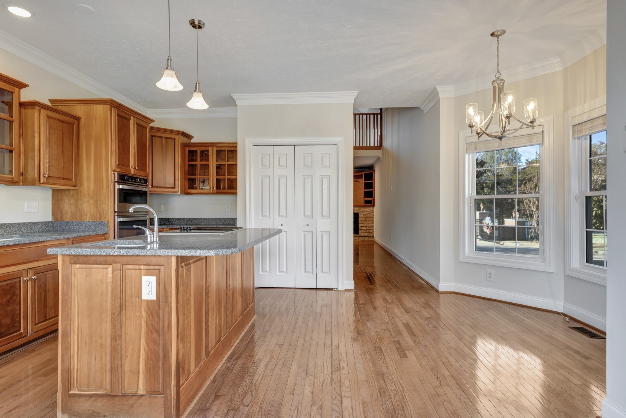 1900 Tinnin Road, Unit A5 Goodlettsville, TN 37072 - Photo 6 of 41 a kitchen with stainless steel appliances granite countertop a sink a stove a refrigerator cabinets and wooden floor
