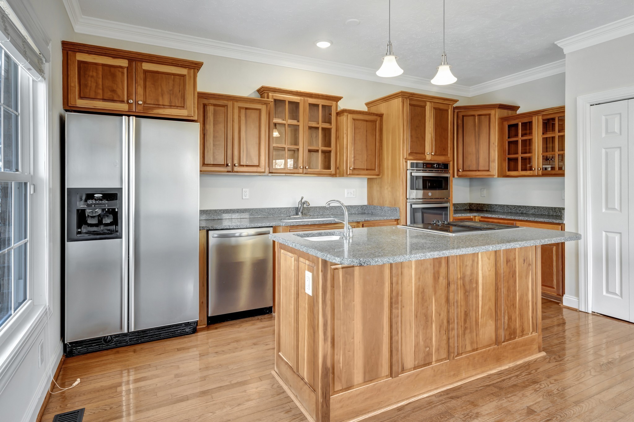 1900 Tinnin Road, Unit A5 Goodlettsville, TN 37072 - Photo 8 of 41 a kitchen with stainless steel appliances granite countertop a refrigerator a sink and a stove